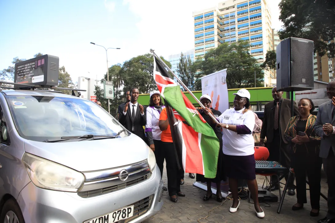Ministry of Gender, Culture, the Arts and Heritage Cabinet Secretary Hanna Wendot flags off a mobile advertising car during the launch of digital campaign against GBV at Teleposta